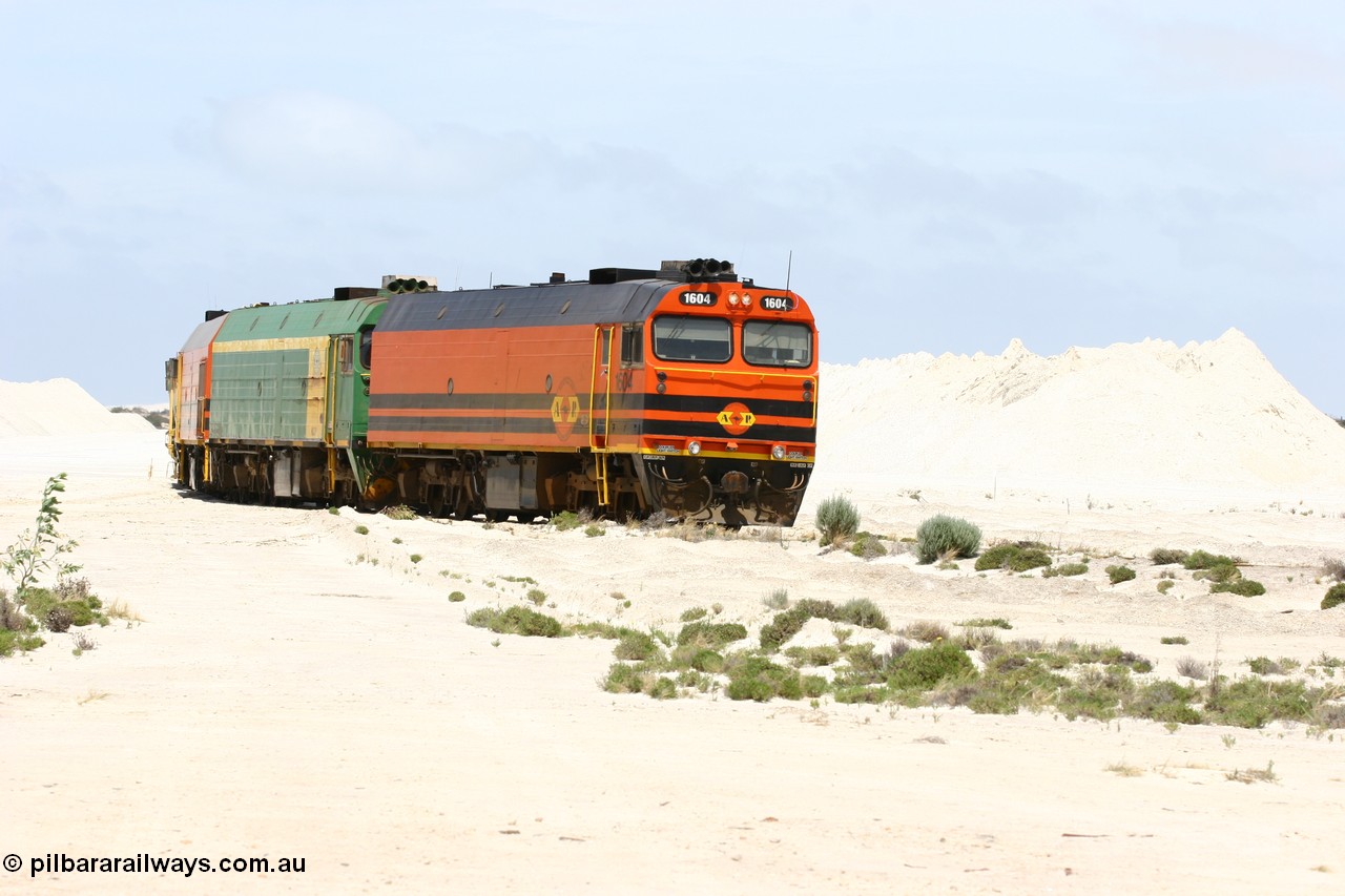 060113 2511
Kevin, empty train 6DD3 shunts back onto the triangle leg behind triple NJ/1600 class units, Clyde Engineering built EMD JL22C models, originally coded the NJ class and built for the Central Australia Railway in 1971, transferred to the Eyre Peninsula in 1981 and recoded to the 1600 class. 13th January 2006.
Keywords: 1600-class;1604;Clyde-Engineering-Granville-NSW;EMD;JL22C;71-731;NJ-class;NJ4;