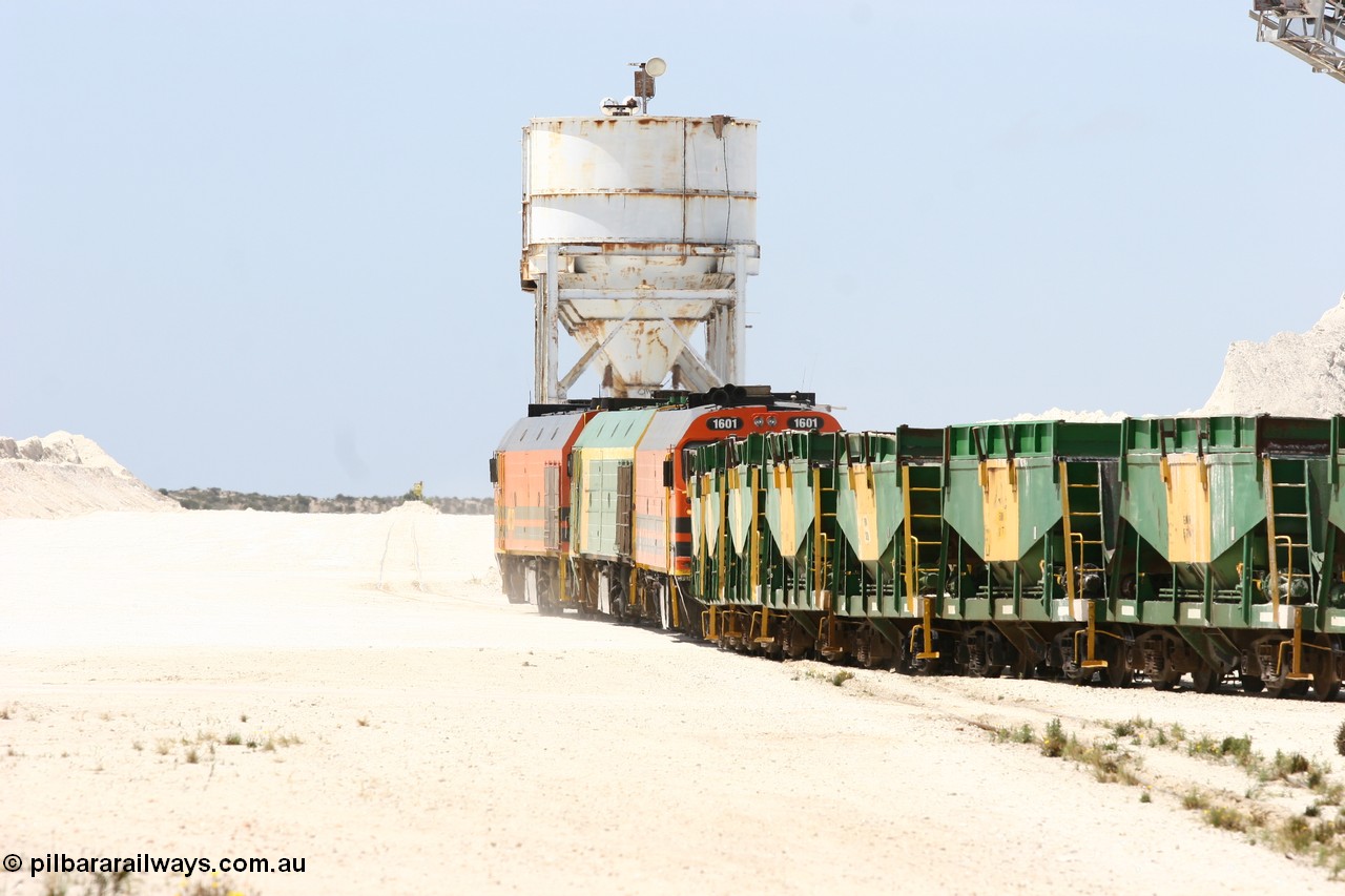 060113 2531
Kevin, empty train 6DD3 is heading onto the south leg with some of the gypsum plant behind the train and a set of original loading bins gypsum loading siding to continue the reversing process. 13th January 2006.
