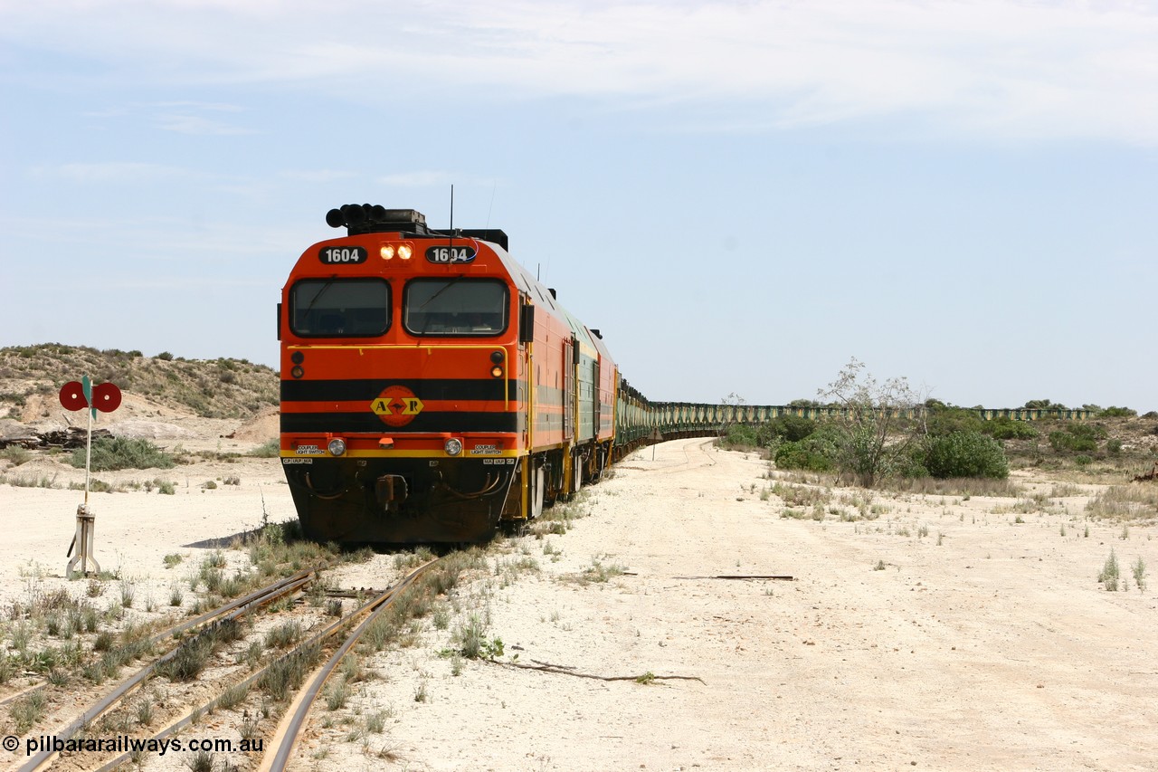 060113 2539
Kevin, 1600 class unit 1604 in Australian Railroad Group livery a Clyde Engineering built EMD JL22C model serial 71-731, originally built as NJ class NJ 4 and built for the Central Australia Railway in 1971, transferred to the Eyre Peninsula in 1981, shunts back along the Penong line with the points indicator set for the siding and the goods siding on the right of the train. [url=https://goo.gl/maps/JyRQW]Kevin station area[/url], as the train is reversed prior to loading on the mainline to Thevenard. 13th January 2006.
Keywords: 1600-class;1604;Clyde-Engineering-Granville-NSW;EMD;JL22C;71-731;NJ-class;NJ4;