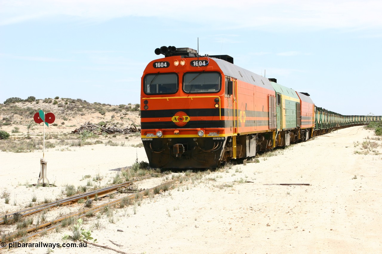 060113 2540
Kevin, 1600 class unit 1604 in Australian Railroad Group livery a Clyde Engineering built EMD JL22C model serial 71-731, originally built as NJ class NJ 4 and built for the Central Australia Railway in 1971, transferred to the Eyre Peninsula in 1981, shunts back along the Penong line with the points indicator set for the siding and the goods siding on the right of the train. [url=https://goo.gl/maps/JyRQW]Kevin station area[/url], as the train is reversed prior to loading on the mainline to Thevenard. 13th January 2006.
Keywords: 1600-class;1604;Clyde-Engineering-Granville-NSW;EMD;JL22C;71-731;NJ-class;NJ4;