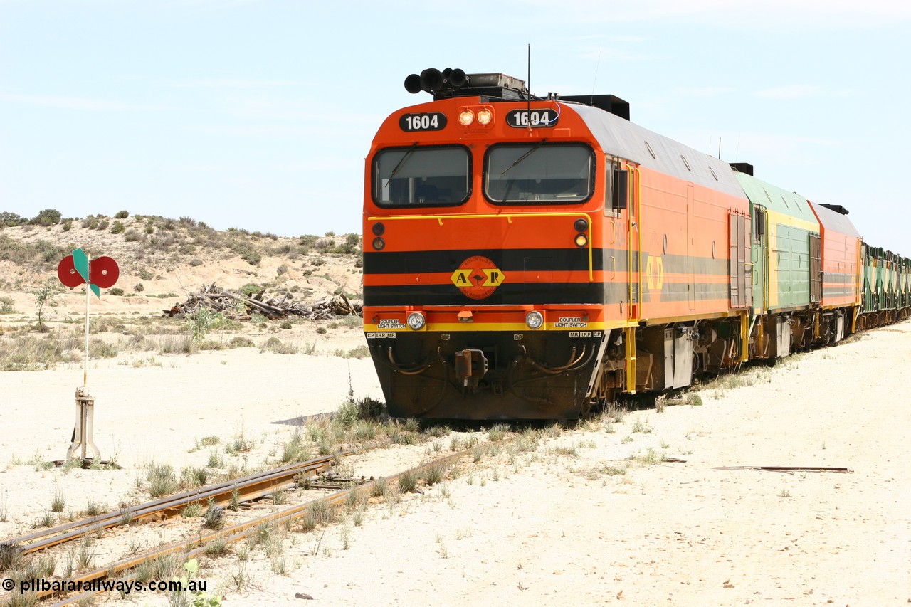 060113 2541
Kevin, narrow gauge locos 1604, NJ 3 and 1601 sit on the mainline to Penong, having reversed train 6DD3 on the Kevin triangle 1600 class unit 1604 in Australian Railroad Group livery a Clyde Engineering built EMD JL22C model serial 71-731, originally built as NJ class NJ 4 and built for the Central Australia Railway in 1971, transferred to the Eyre Peninsula in 1981. 13th January 2006.
Keywords: 1600-class;1604;Clyde-Engineering-Granville-NSW;EMD;JL22C;71-731;NJ-class;NJ4;