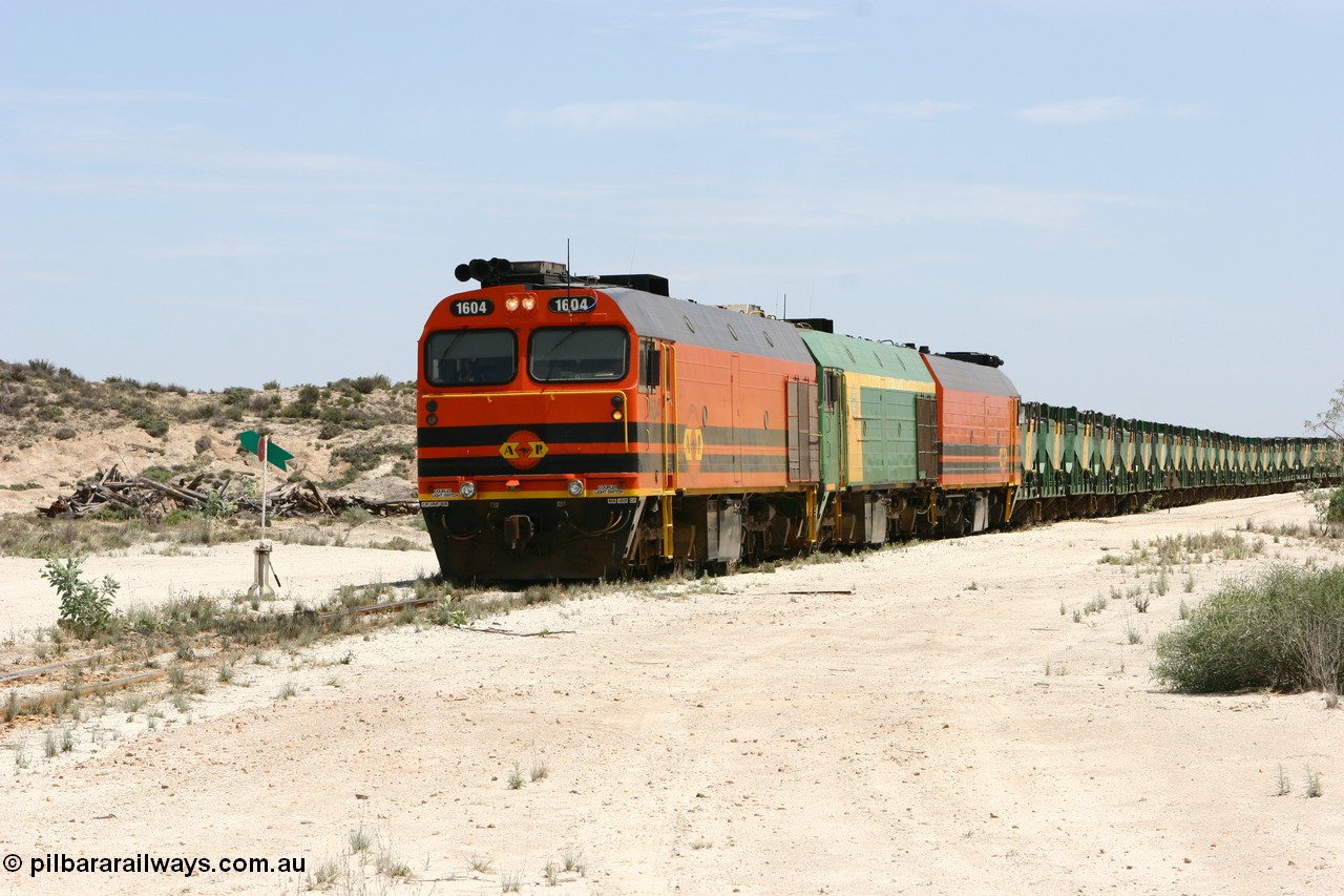 060113 2542
Kevin, with the points now set again for the mainline narrow gauge locos 1604, NJ 3 and 1601 sit on the mainline to Penong, having reversed train 6DD3 on the Kevin triangle 1600 class unit 1604 in Australian Railroad Group livery a Clyde Engineering built EMD JL22C model serial 71-731, originally built as NJ class NJ 4 and built for the Central Australia Railway in 1971, transferred to the Eyre Peninsula in 1981. 13th January 2006.
Keywords: 1600-class;1604;Clyde-Engineering-Granville-NSW;EMD;JL22C;71-731;NJ-class;NJ4;