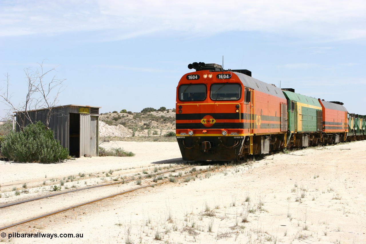 060113 2543
Kevin, narrow gauge locos 1604, NJ 3 and 1601 take the mainline to Thevenard, having reversed train 6DD3 on the Kevin triangle as they prepare to load, 1600 class unit 1604 in Australian Railroad Group livery a Clyde Engineering built EMD JL22C model serial 71-731, originally built as NJ class NJ 4 and built for the Central Australia Railway in 1971, transferred to the Eyre Peninsula in 1981. 13th January 2006.
Keywords: 1600-class;1604;Clyde-Engineering-Granville-NSW;EMD;JL22C;71-731;NJ-class;NJ4;