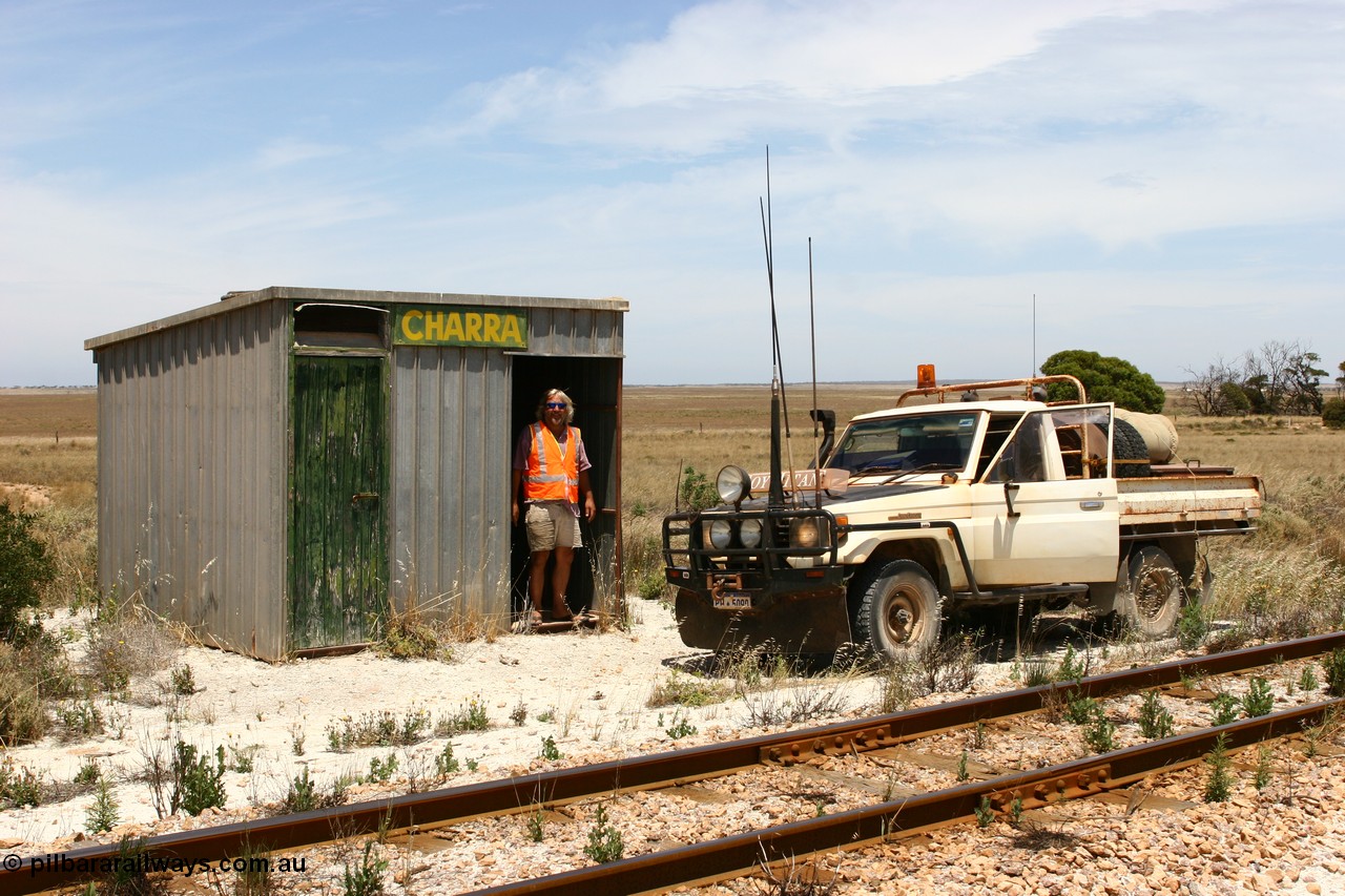 060113 2555
Charra at the 466.2 km, Pope Searle checks out the [url=https://goo.gl/maps/GpLTsHYeUymGtK5f7]Mallee style shelter building[/url]. Opened with the line on 13th February 1966 as a goods siding, reclassified as passing siding and extended, new goods loop siding constructed May 1982. 13th January 2006.
