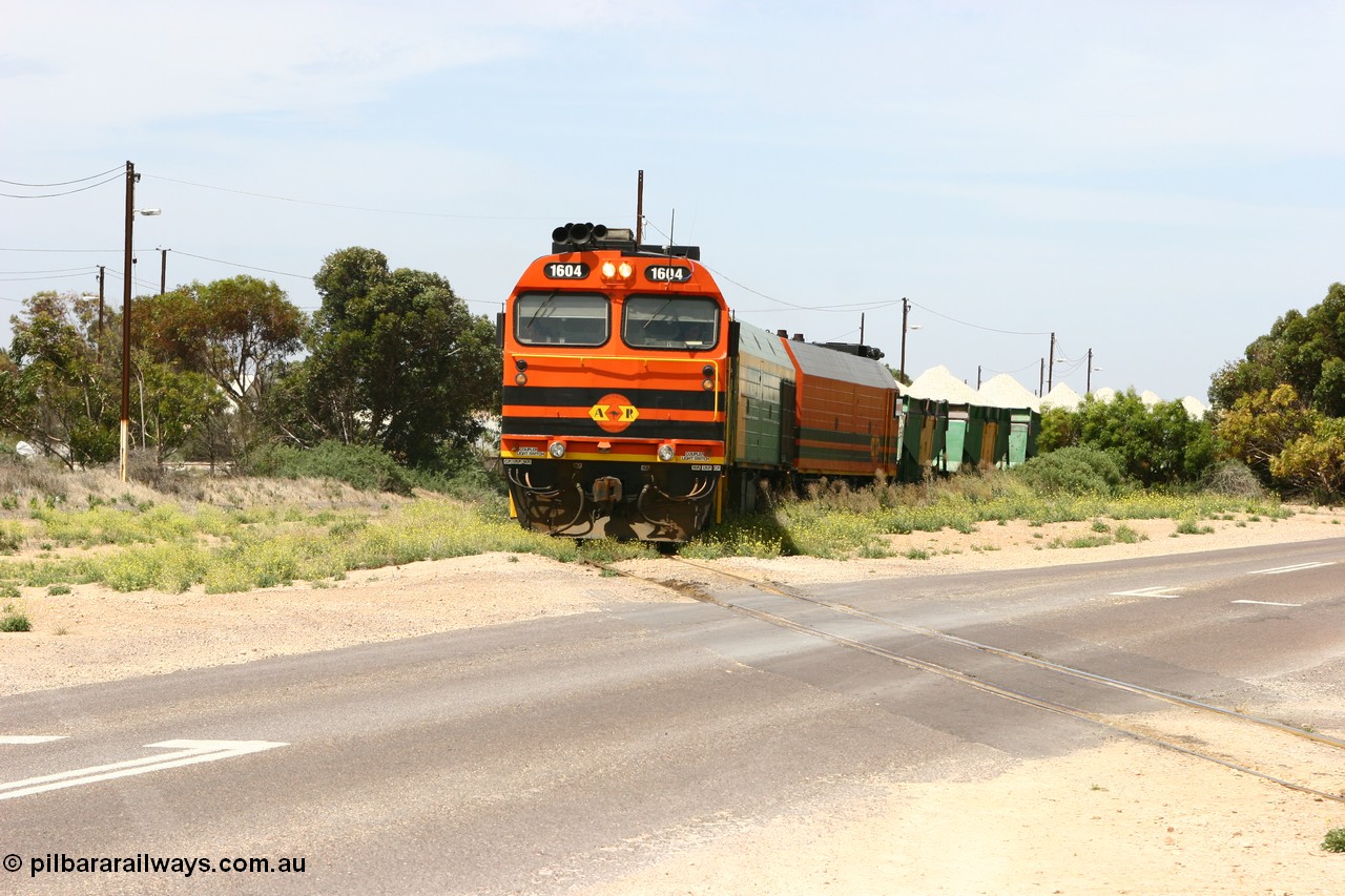 060113 2561
Thevenard, loaded gypsum train 6DD4 snakes through the yard as it is about to cross Bergmann Drive behind 1600 class unit 1604 in Australian Railroad Group livery a Clyde Engineering built EMD JL22C model serial 71-731, originally built as NJ class NJ 4. [url=https://goo.gl/maps/9g3QoE4iaiDjqyta9]Bergmann Dr grade crossing[/url]. 13th January 2006.
Keywords: 1600-class;1604;Clyde-Engineering-Granville-NSW;EMD;JL22C;71-731;NJ-class;NJ4;