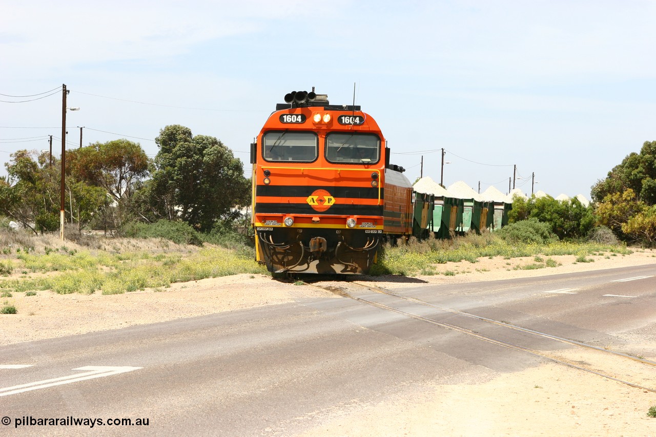 060113 2562
Thevenard, loaded gypsum train 6DD4 snakes through the yard as it is about to cross Bergmann Drive behind 1600 class unit 1604 in Australian Railroad Group livery a Clyde Engineering built EMD JL22C model serial 71-731, originally built as NJ class NJ 4. [url=https://goo.gl/maps/9g3QoE4iaiDjqyta9]Bergmann Dr grade crossing[/url]. 13th January 2006.
Keywords: 1600-class;1604;Clyde-Engineering-Granville-NSW;EMD;JL22C;71-731;NJ-class;NJ4;