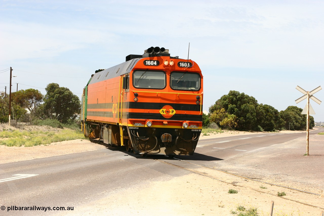 060113 2564
Thevenard, loaded gypsum train 6DD4 snakes through the yard and crosses Bergmann Drive behind 1600 class unit 1604 in Australian Railroad Group livery a Clyde Engineering built EMD JL22C model serial 71-731, originally built as NJ class NJ 4. [url=https://goo.gl/maps/9g3QoE4iaiDjqyta9]Bergmann Dr grade crossing[/url]. 13th January 2006.
Keywords: 1600-class;1604;Clyde-Engineering-Granville-NSW;EMD;JL22C;71-731;NJ-class;NJ4;