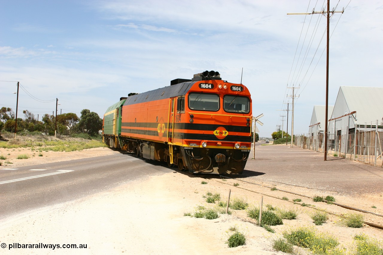 060113 2565
Thevenard, loaded gypsum train 6DD4 snakes through the yard and crosses Bergmann Drive behind 1600 class unit 1604 in Australian Railroad Group livery a Clyde Engineering built EMD JL22C model serial 71-731, originally built as NJ class NJ 4. [url=https://goo.gl/maps/9g3QoE4iaiDjqyta9]Bergmann Dr grade crossing[/url]. 13th January 2006.
Keywords: 1600-class;1604;Clyde-Engineering-Granville-NSW;EMD;JL22C;71-731;NJ-class;NJ4;