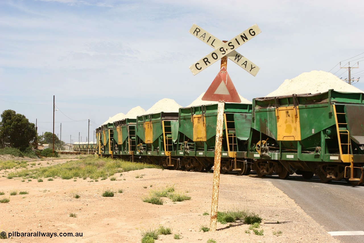 060113 2568
Thevenard, the string of ENH and ENHA waggons loaded high with gypsum on train 6DD4 as the snake through the yard destined for the unloader. [url=https://goo.gl/maps/9g3QoE4iaiDjqyta9]Bergmann Dr grade crossing[/url]. 13th January 2006.
Keywords: ENH-type;ENH57;Kinki-Sharyo-Japan;NH-type;NH957;