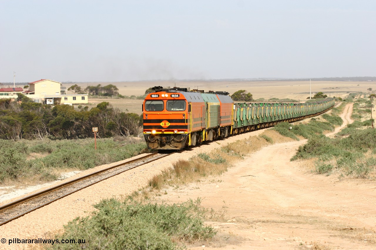 060113 2580
Ceduna, or Denial Bay area, empty gypsum train 6DD5 blasts up hill at the 440 km, west of Carpenter Corner Rd with power from triple 1600/NJ class units 1604, NJ 3 and 1601. 1604 in Australian Railroad Group livery is a Clyde Engineering built EMD JL22C model serial 71-731, originally built as NJ class NJ 4. [url=https://goo.gl/maps/ULA2PjjKh6nhwHTdA]Location approximation[/url]. 13th January 2006.
Keywords: 1600-class;1604;Clyde-Engineering-Granville-NSW;EMD;JL22C;71-731;NJ-class;NJ4;