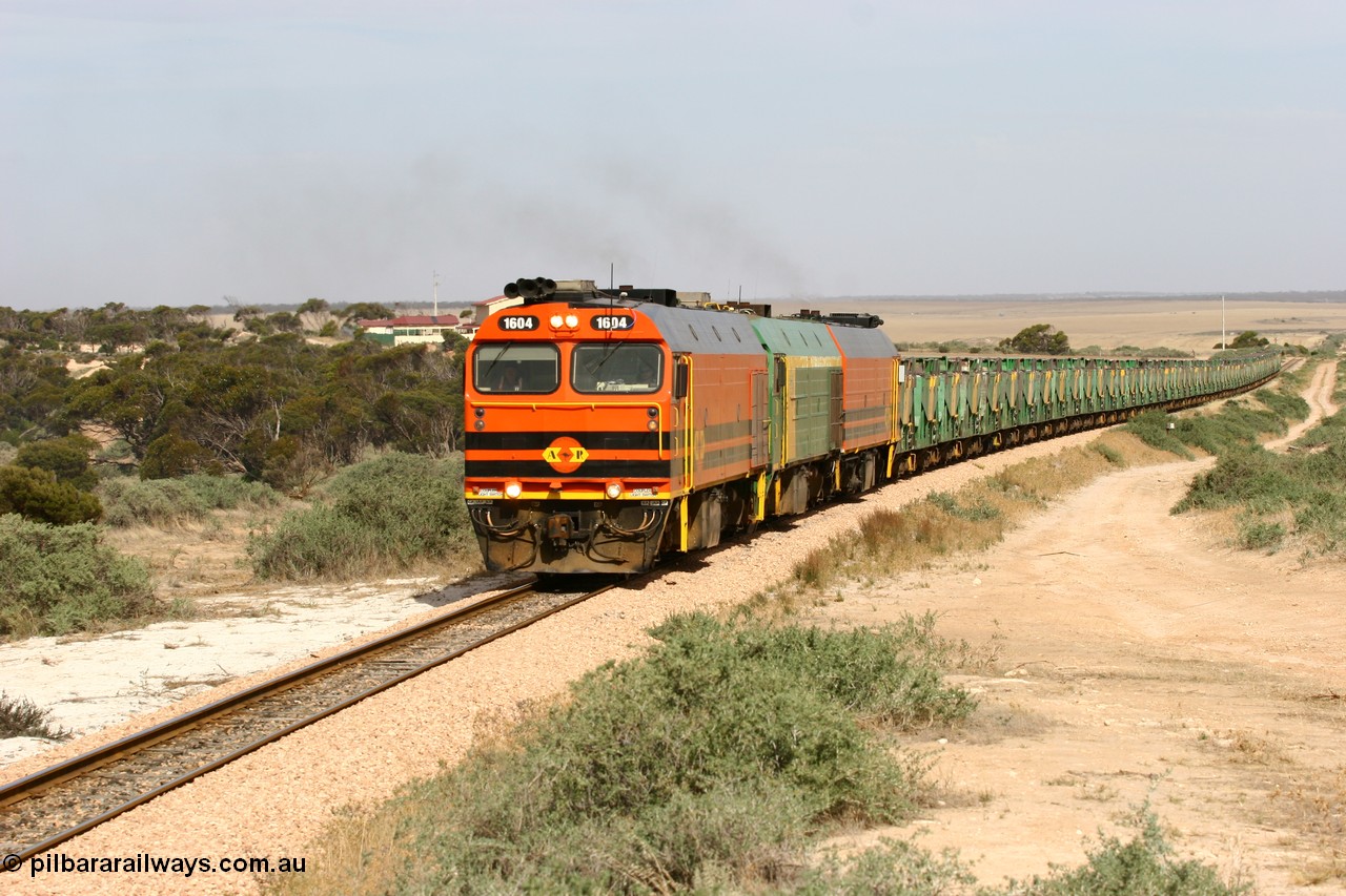 060113 2582
Ceduna, or Denial Bay area, empty gypsum train 6DD5 blasts up hill at the 440 km, west of Carpenter Corner Rd with power from triple 1600/NJ class units 1604, NJ 3 and 1601. 1604 in Australian Railroad Group livery is a Clyde Engineering built EMD JL22C model serial 71-731, originally built as NJ class NJ 4. [url=https://goo.gl/maps/ULA2PjjKh6nhwHTdA]Location approximation[/url]. 13th January 2006.
Keywords: 1600-class;1604;Clyde-Engineering-Granville-NSW;EMD;JL22C;71-731;NJ-class;NJ4;