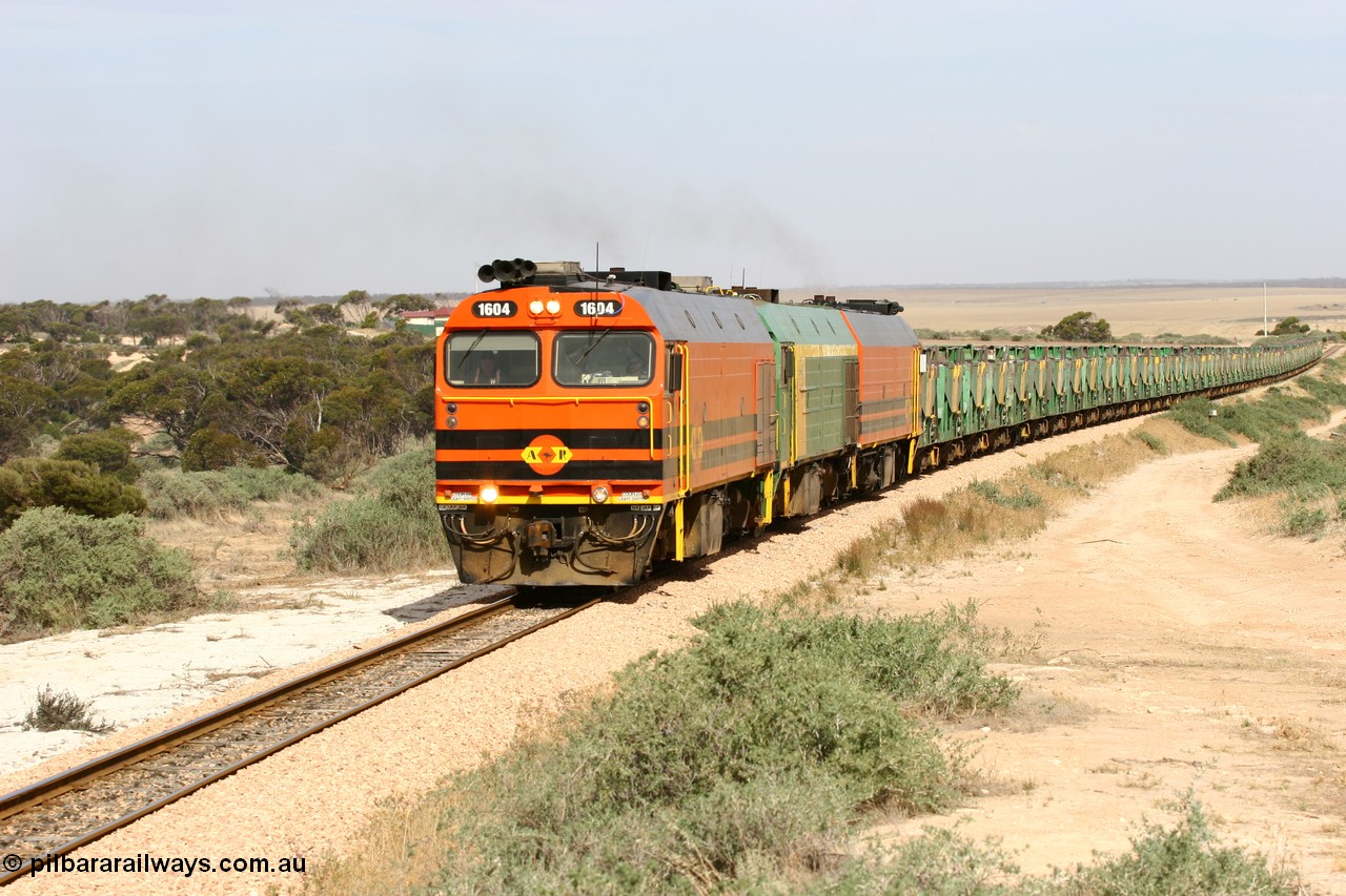 060113 2583
Ceduna, or Denial Bay area, empty gypsum train 6DD5 blasts up hill at the 440 km, west of Carpenter Corner Rd with power from triple 1600/NJ class units 1604, NJ 3 and 1601. 1604 in Australian Railroad Group livery is a Clyde Engineering built EMD JL22C model serial 71-731, originally built as NJ class NJ 4. [url=https://goo.gl/maps/ULA2PjjKh6nhwHTdA]Location approximation[/url]. 13th January 2006.
Keywords: 1600-class;1604;Clyde-Engineering-Granville-NSW;EMD;JL22C;71-731;NJ-class;NJ4;