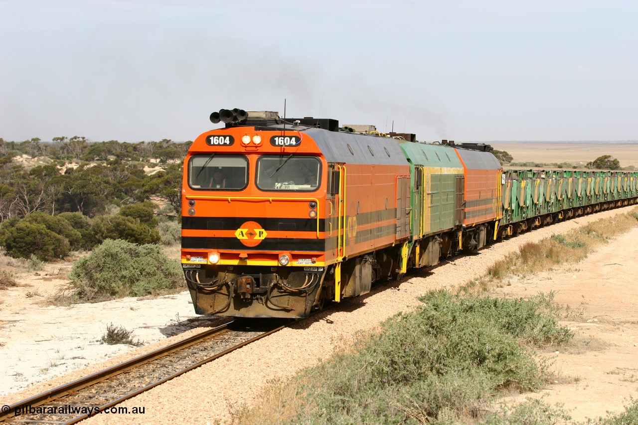 060113 2584
Ceduna, or Denial Bay area, empty gypsum train 6DD5 blasts up hill at the 440 km, west of Carpenter Corner Rd with power from triple 1600/NJ class units 1604, NJ 3 and 1601. 1604 in Australian Railroad Group livery is a Clyde Engineering built EMD JL22C model serial 71-731, originally built as NJ class NJ 4. [url=https://goo.gl/maps/ULA2PjjKh6nhwHTdA]Location approximation[/url]. 13th January 2006.
Keywords: 1600-class;1604;Clyde-Engineering-Granville-NSW;EMD;JL22C;71-731;NJ-class;NJ4;