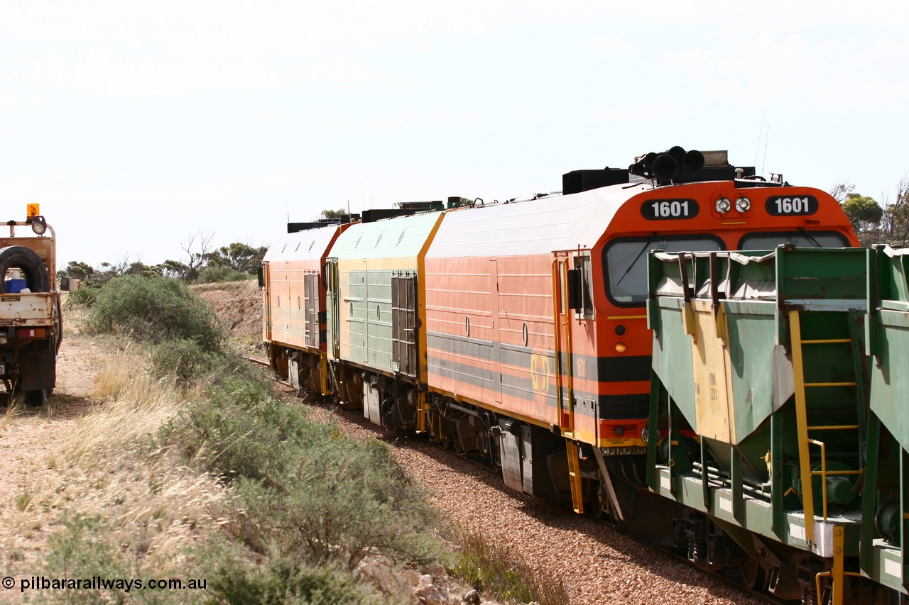 060113 2587
Ceduna, or Denial Bay area, empty gypsum train 6DD5 blasts up hill at the 440 km, west of Carpenter Corner Rd with power from triple 1600/NJ class units 1604, NJ 3 and 1601. 1601 in Australian Railroad Group livery is a Clyde Engineering built EMD JL22C model serial 71-728, originally built as NJ class NJ 1. [url=https://goo.gl/maps/ULA2PjjKh6nhwHTdA]Location approximation[/url]. 13th January 2006.
Keywords: 1600-class;1601;Clyde-Engineering-Granville-NSW;EMD;JL22C;71-728;NJ-class;NJ1;