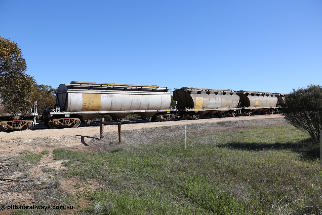 130703 0144
Murdinga, HCN 4 and HAN 27, HCN type bogie grain hopper waggon HCN 4, originally an NHB type hopper built by Tulloch Ltd for the Commonwealth Railways North Australia Railway. One of forty rebuilt by Islington Workshops 1978-79 to the HCN type with a 36 ton rating, increased to 40 tonnes in 1984. Seen here loaded with grain with a Moose Metalworks roll-top cover, HAN 27 is one of sixty eight waggons built by South Australian Railways Islington Workshops between 1969 and 1973 as the HAN type for the Eyre Peninsula system. 3rd July 2013.
Keywords: HCN-type;HCN4;SAR-Islington-WS;rebuild;Tulloch-Ltd-NSW;NHB-type;NHB1017;