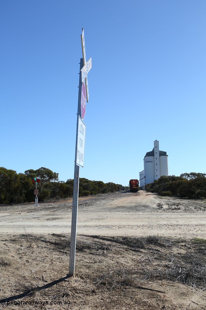130703 0160
Murdinga, overview of the station yard looking north, siding point lever and indicator, Mallee style shelter train control building in the far distance on the left beside train, grain train loading on the siding, eight cell concrete grain silo complex with Ascom single cell behind it. [url=https://goo.gl/maps/LShPNnU33Qbmc1879]Geo location[/url]. 3rd July 2013.
