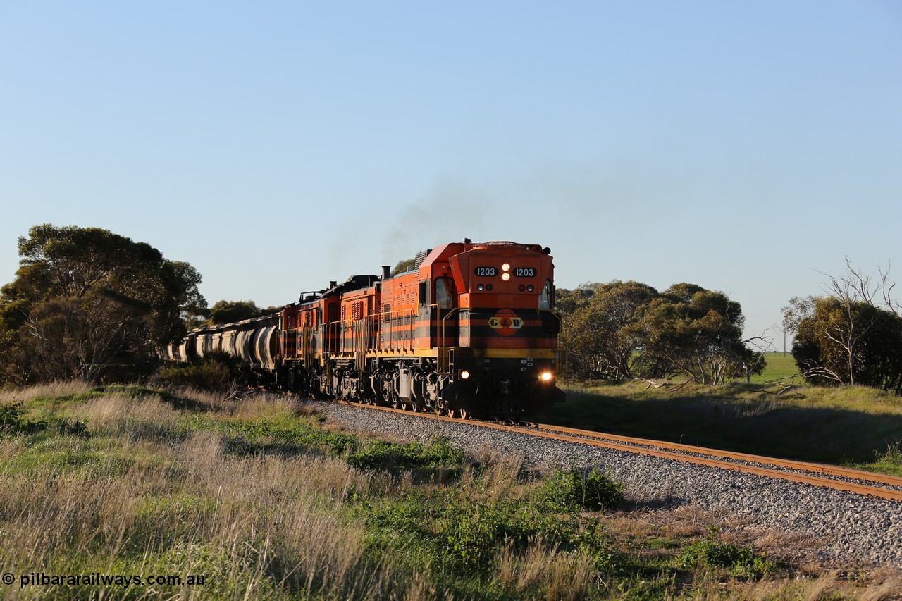 130703 0250
Kaldow, running south with the sun behind it is 1200 class 1204 a Clyde Engineering built EMD G12C model with serial 65-428 leading two ALCo units and was originally built in 1965 for Western Mining Corporation and operated by the WAGR as their A class A 1513. It came to the Eyre Peninsula in October 2004. [url=https://goo.gl/maps/FnDpXh45LbN7scrt5]Geo location[/url]. 3rd July 2013.
Keywords: 1200-class;1203;Clyde-Engineering-Granville-NSW;EMD;G12C;65-427;A-class;A1513;