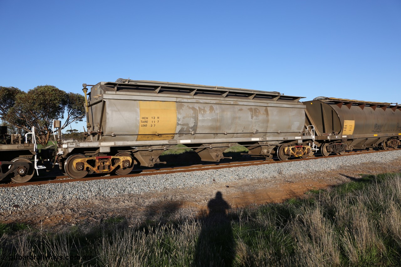 130703 0273
Kaldow, HCN type bogie grain hopper waggon HCN 12, originally an NHB type hopper built by Tulloch Ltd for the Commonwealth Railways North Australia Railway. One of forty rebuilt by Islington Workshops 1978-79 to the HCN type with a 36 ton rating, increased to 40 tonnes in 1984. Seen here loaded with grain with a Moose Metalworks roll-top cover. [url=https://goo.gl/maps/bG8SzxeWzL1eSEWUA]Geo location[/url]. 3rd July 2013.
Keywords: HCN-type;HCN12;SAR-Islington-WS;rebuild;Tulloch-Ltd-NSW;NHB-type;NHB1591;