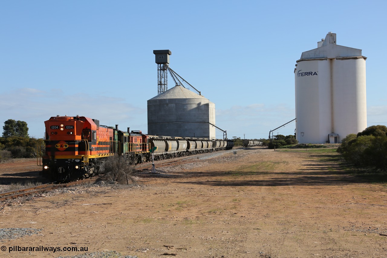 130704 0372
Kyancutta, south bound loaded grain train has stopped here to collect a loaded rack of fourteen grain waggons from the Ascom silo complex, Clyde Engineering built EMD G12C model 1204 serial 65-428 leads the train and was originally built in 1965 for Western Mining Corporation and operated by the WAGR as their A class A 1514.
Keywords: 1200-class;1204;Clyde-Engineering-Granville-NSW;EMD;G12C;65-428;A-class;A1514;