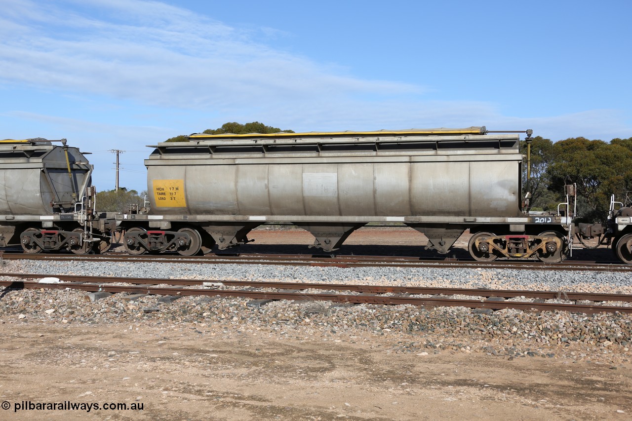 130704 0400
Kyancutta, HCN type bogie grain hopper waggon HCN 17, originally an NHB type hopper built by Tulloch Ltd for the Commonwealth Railways North Australia Railway. One of forty rebuilt by Islington Workshops 1978-79 to the HCN type with a 36 ton rating, increased to 40 tonnes in 1984. Seen here loaded with grain with a Moose Metalworks roll-top cover.
Keywords: HCN-type;HCN17;SAR-Islington-WS;rebuild;Tulloch-Ltd-NSW;NHB-type;NHB1016;