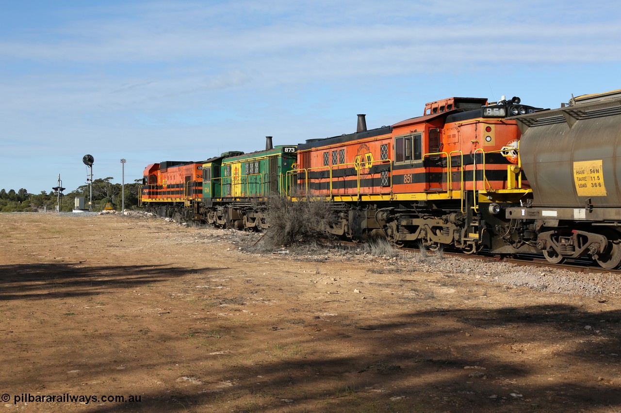 130704 0416
Kyancutta, south bound loaded grain train has stopped here to collect a loaded rack of grain waggons, seen here backing up to re-join the rest of the train on the mainline with one of only three electric signals on the network which a sharp eye might notice has turned green, behind EMD 1204 and twin ALCo 830 units 873 and 851. 4th July 2013.
Keywords: 830-class;851;AE-Goodwin;ALCo;DL531;84137;