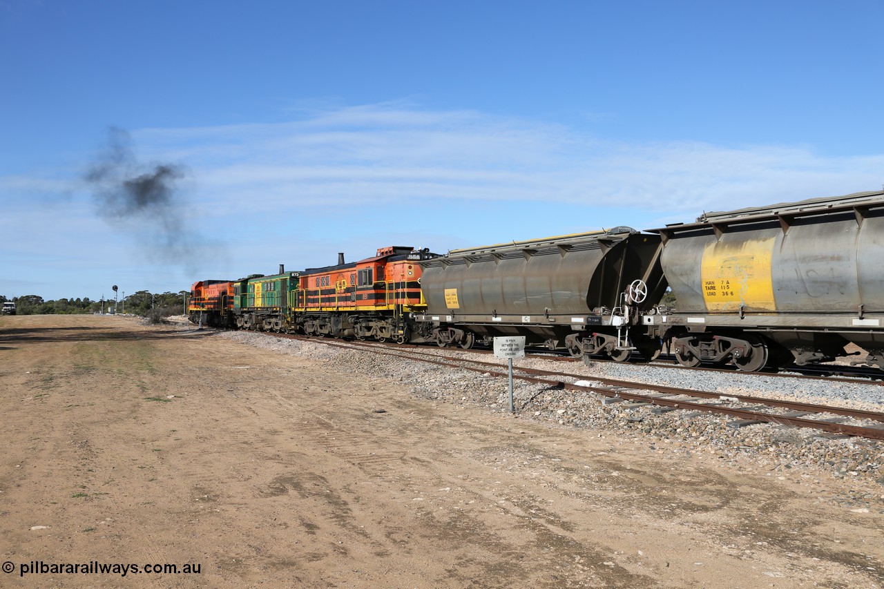 130704 0421
Kyancutta, south bound loaded grain train has stopped here to collect a loaded rack of grain waggons, seen here backing up to re-join the rest of the train on the mainline with one of only three electric signals on the network with the original goods siding closest to the camera, behind EMD 1204 and twin ALCo 830 units 873 and 851. 4th July 2013.
Keywords: HAN-type;HAN54;1969-73/68-54;SAR-Islington-WS;