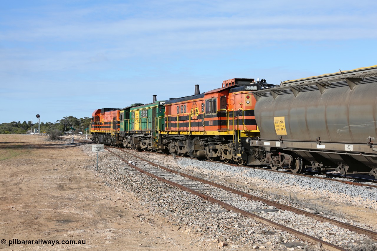 130704 0422
Kyancutta, south bound loaded grain train has stopped here to collect a loaded rack of grain waggons, seen here backing up to re-join the rest of the train on the mainline with one of only three electric signals on the network with the original goods siding closest to the camera, behind EMD 1204 and twin ALCo 830 units 873 and 851. 4th July 2013.
Keywords: 830-class;851;AE-Goodwin;ALCo;DL531;84137;