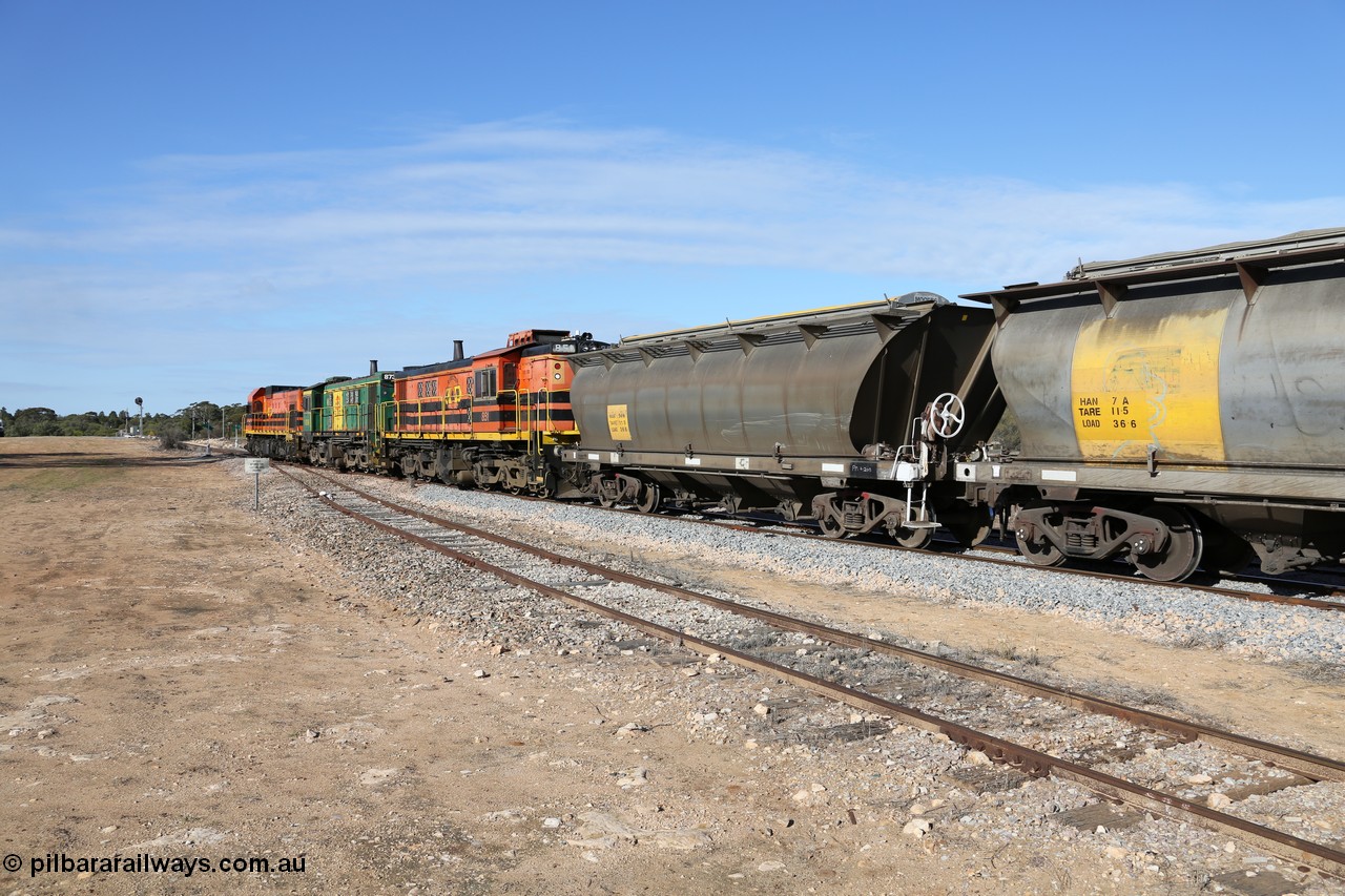 130704 0423
Kyancutta, south bound loaded grain train has stopped here to collect a loaded rack of grain waggons, seen here backing up to re-join the rest of the train on the mainline with one of only three electric signals on the network with the original goods siding closest to the camera, behind EMD 1204 and twin ALCo 830 units 873 and 851. 4th July 2013.
Keywords: HAN-type;HAN54;1969-73/68-54;SAR-Islington-WS;
