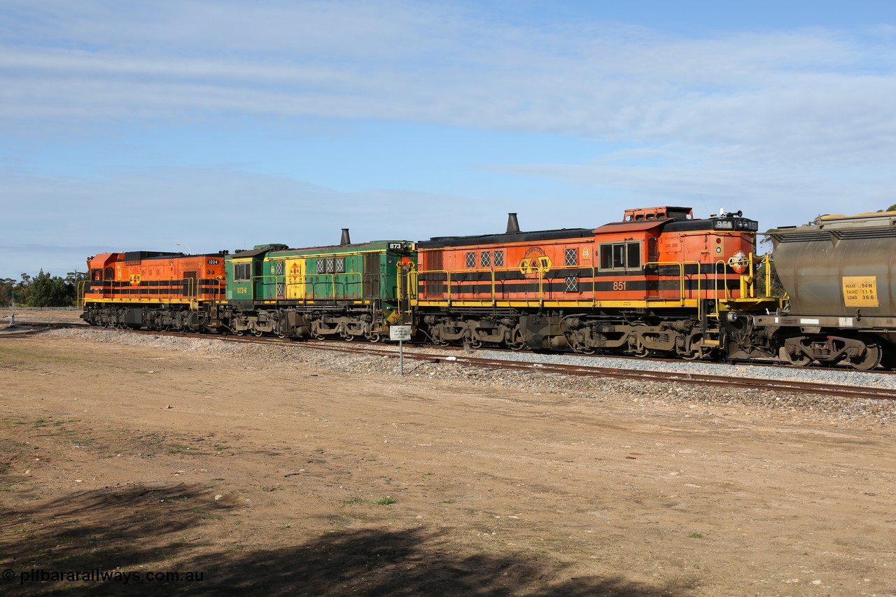 130704 0426
Kyancutta, south bound loaded grain train seen here testing the brake after picking up more loaded waggons and rejoining the train, with the original goods siding closest to the camera, behind 1200 class EMD G12C model 1204 and twin ALCo DL531 model 830 units 873 and 851. 4th July 2013.
Keywords: 830-class;851;AE-Goodwin;ALCo;DL531;84137;