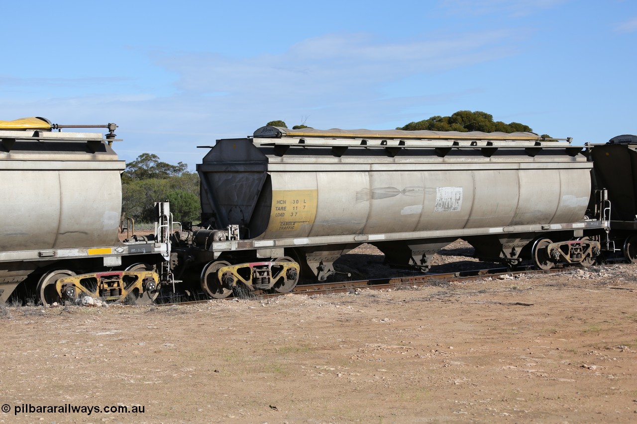 130704 0473
Kyancutta, HCN type bogie grain hopper waggon HCN 30, originally an NHB type hopper built by Tulloch Ltd for the Commonwealth Railways North Australia Railway. One of forty rebuilt by Islington Workshops 1978-79 to the HCN type with a 36 ton rating, increased to 40 tonnes in 1984. Seen here loaded with grain with a Moose Metalworks roll-top cover.
Keywords: HCN-type;HCN30;SAR-Islington-WS;rebuild;Tulloch-Ltd-NSW;NHB-type;NHB1593;