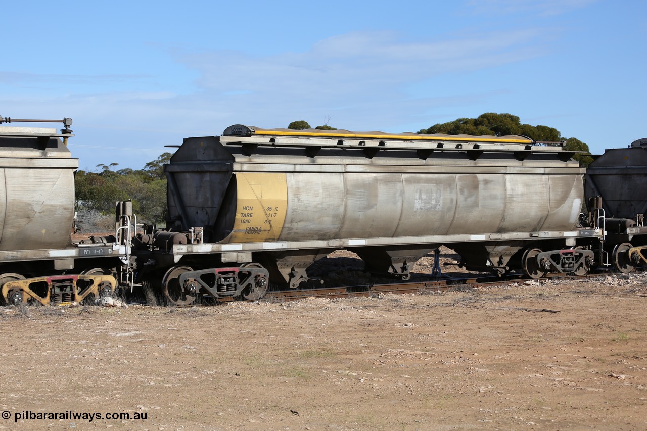 130704 0479
Kyancutta, HCN type bogie grain hopper waggon HCN 35, originally an NHB type hopper built by Tulloch Ltd for the Commonwealth Railways North Australia Railway. One of forty rebuilt by Islington Workshops 1978-79 to the HCN type with a 36 ton rating, increased to 40 tonnes in 1984. Seen here loaded with grain with a Moose Metalworks roll-top cover.
Keywords: HCN-type;HCN35;SAR-Islington-WS;rebuild;Tulloch-Ltd-NSW;NHB-type;NHB1582;