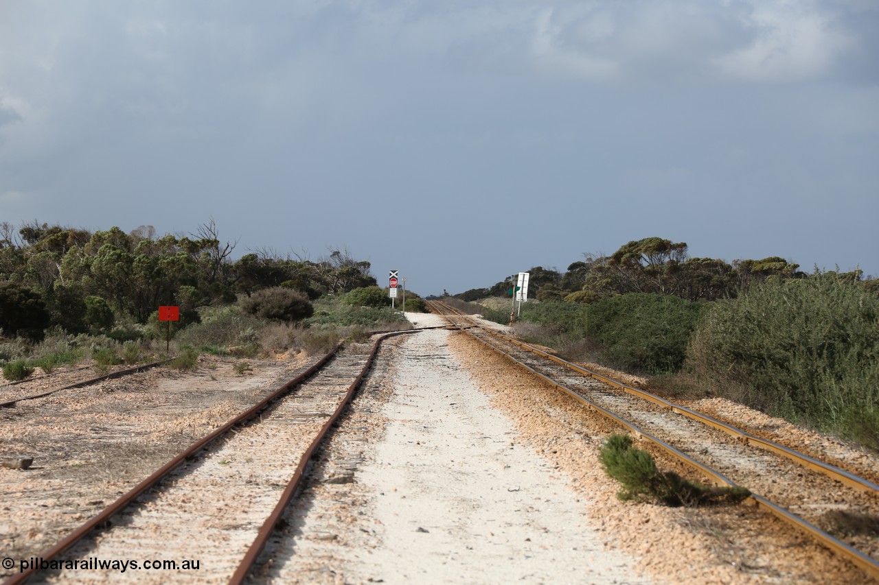 130704 0487
Moule, looking east, Moule located at the 445.6 km was opened in February 1966 when the Direct Line between Ceduna and Kevin was opened. From the left is the end of the ballast siding with the crossing loop rejoining the mainline just before the grade crossing to access the ballast stockpile area. [url=https://goo.gl/maps/KTtpy7LJB4tmHaTt6]Location is here[/url]. 4th July 2013.
