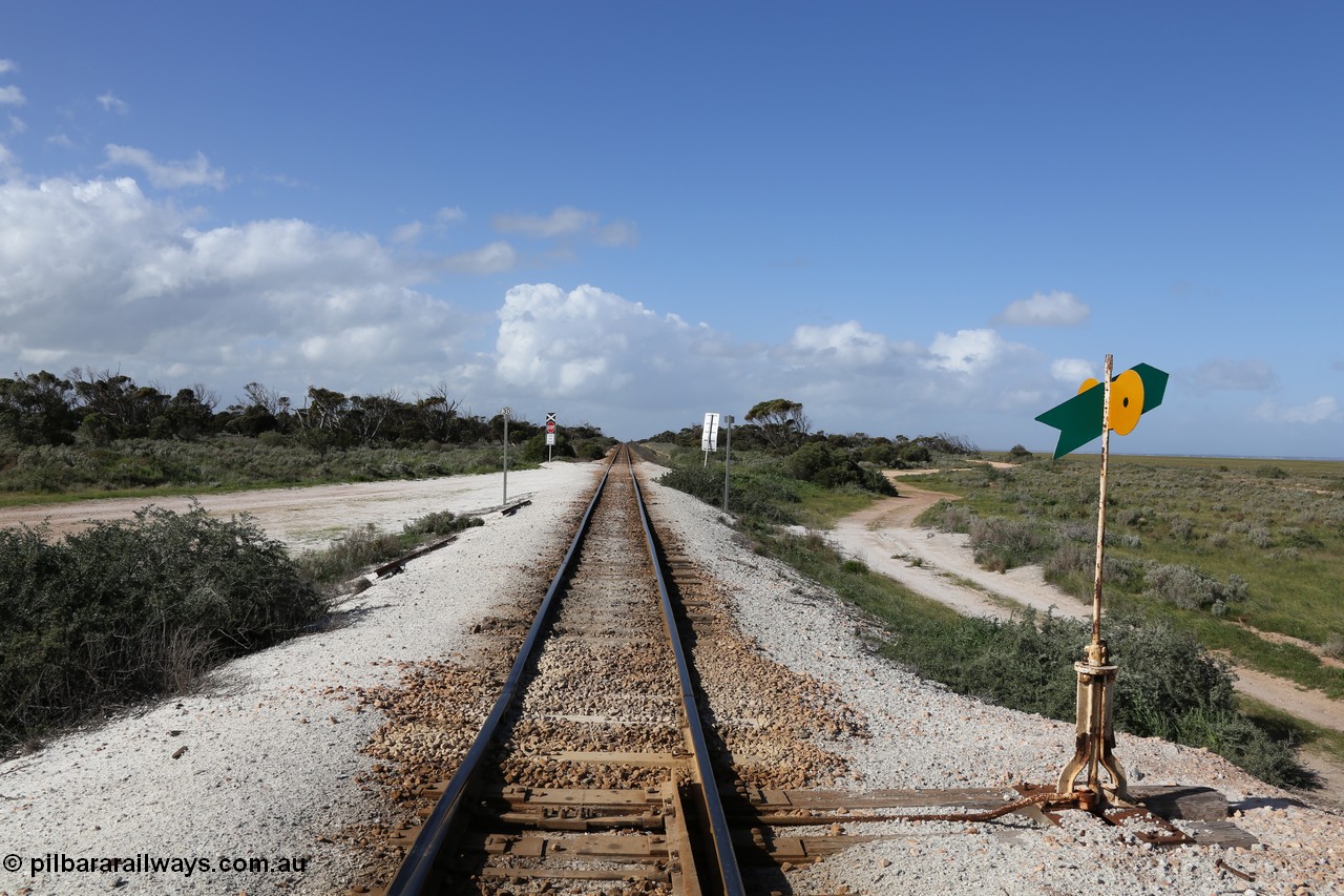130704 0505
Moule, view looking east from the eastern end of the crossing loop with the point lever and indicator. The small 30 sign is the speed limit, the grade crossing is to access the ballast stockpile area. 4th July 2013.
