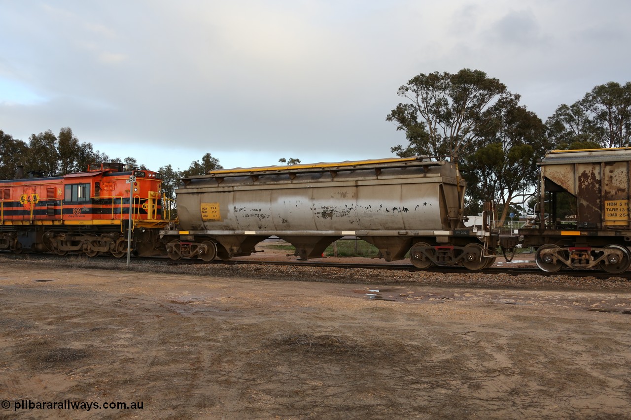 130705 0552
Lock, HCN type bogie grain hopper waggon HCN 39, originally an NHB type hopper NHB 1573 built by Tulloch Ltd for the Commonwealth Railways North Australia Railway. One of forty rebuilt by Islington Workshops 1978-79 to the HCN type with a 36 ton rating, increased to 40 tonnes in 1984. Fitted with a Moose Metalworks roll-top cover. 5th July 2013.
Keywords: HCN-type;HCN39;SAR-Islington-WS;rebuild;Tulloch-Ltd-NSW;NHB-type;NHB1573;