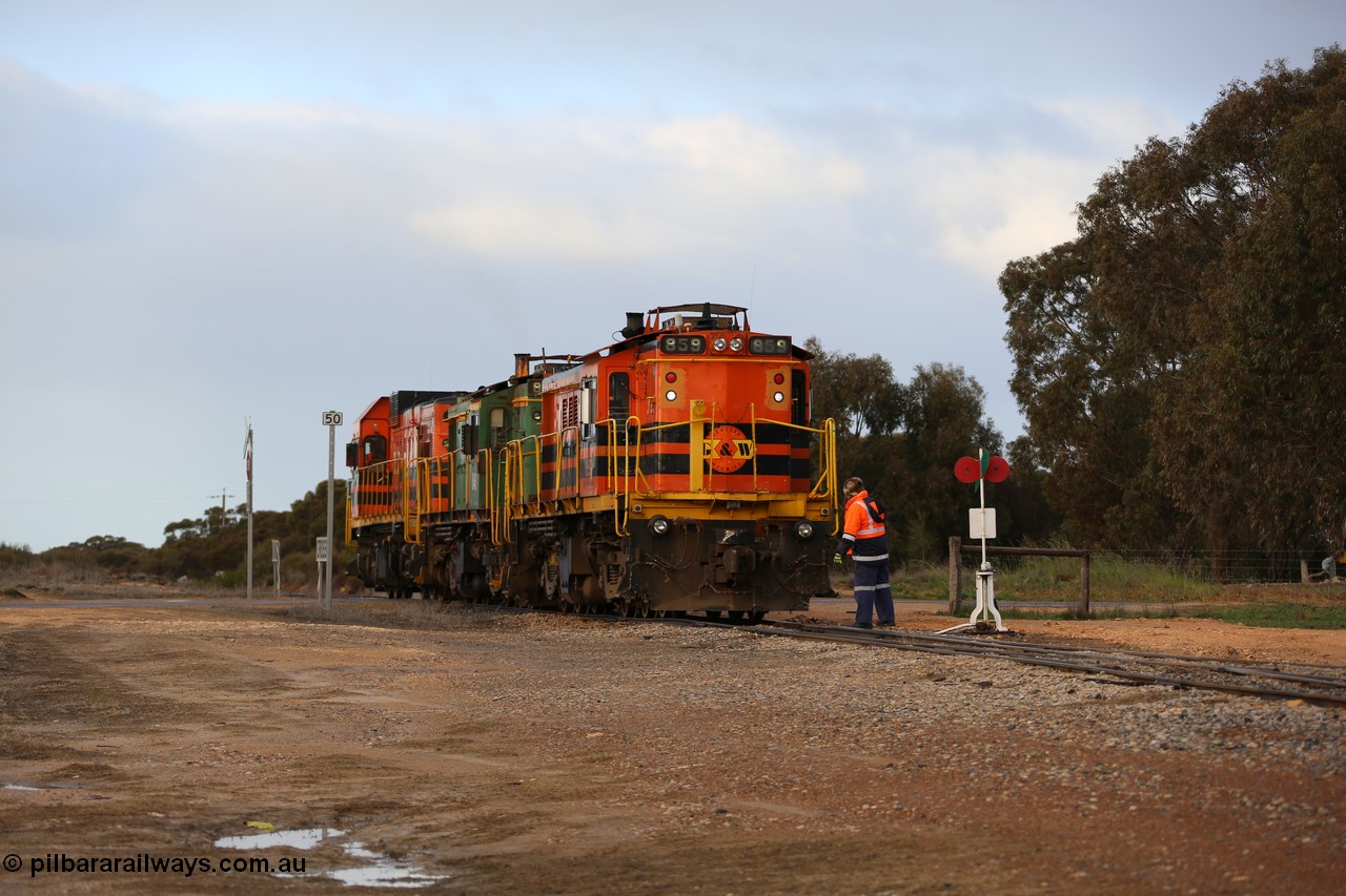 130705 0587
Lock, having stowed the loaded portion on the mainline, the three locos 859, 846 and 1203 shunt back on to the empty portion on goods siding #1. 
Keywords: 830-class;859;AE-Goodwin;ALCo;DL531;84705;
