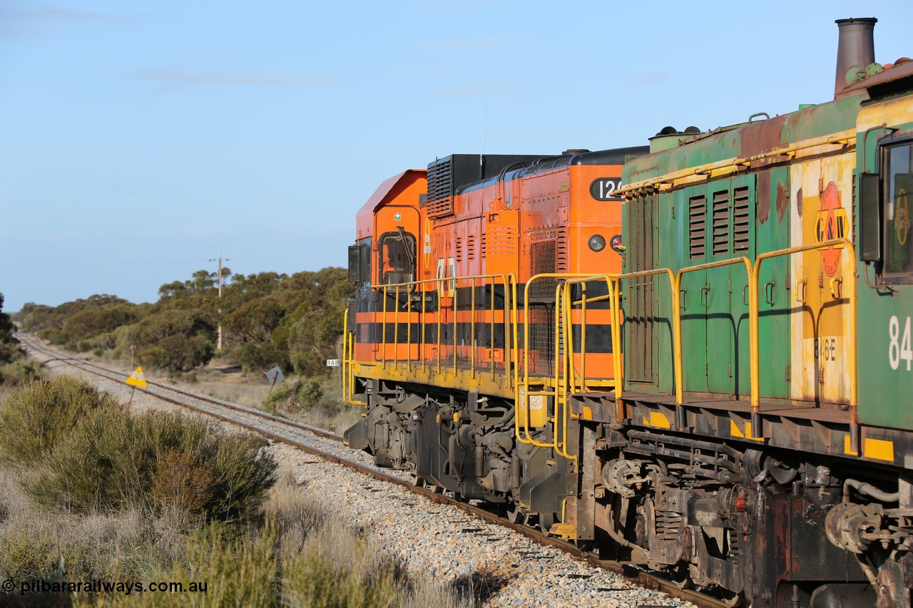 130705 0658
Lock, 1203, 846 and 859 depart along the mainline for Port Lincoln with the loaded grain train.
