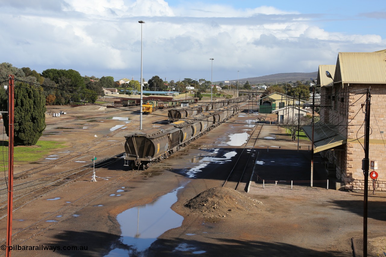 130706 0668
Port Lincoln, looking in the down direction from the London Street overbridge at the yard environs with the station at right which was Eyre Peninsula 'head offices'. 6th of July 2013.
