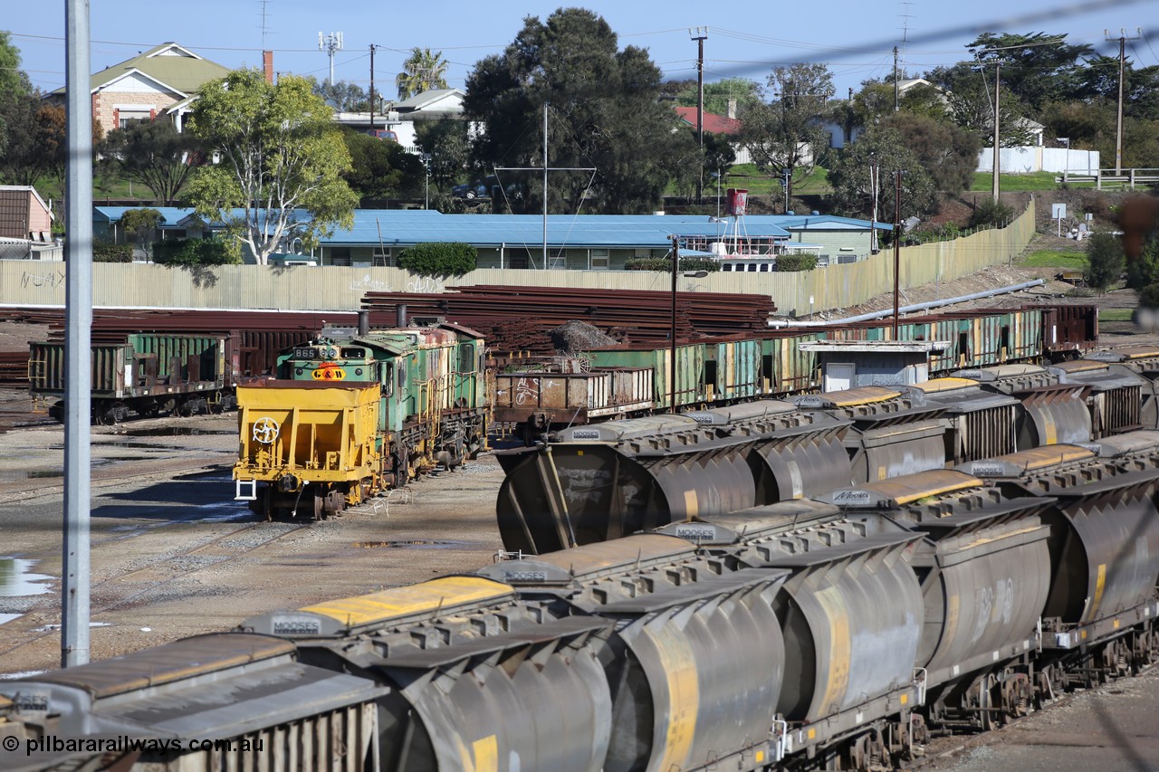 130706 0669
Port Lincoln, looking in the down direction from the London Street overbridge at the weigh bridge and stowed 830 class units and the ballast waggons. 6th of July 2013.

