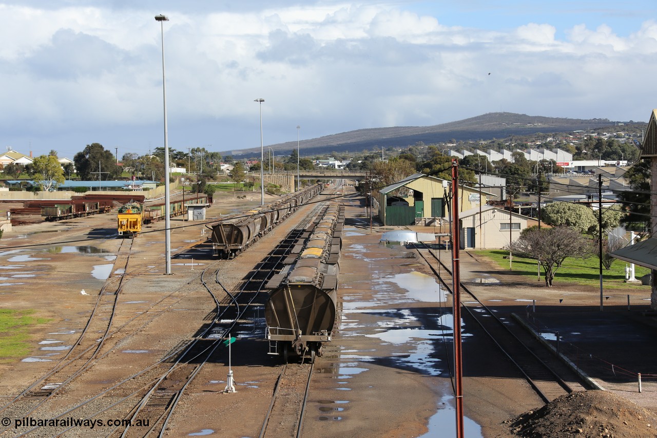 130706 0672
Port Lincoln, looking in the down direction from the London Street overbridge at the yard environs with the station at the extreme right, with the AN Freight Shed now museum in the middle background. 6th of July 2013.
