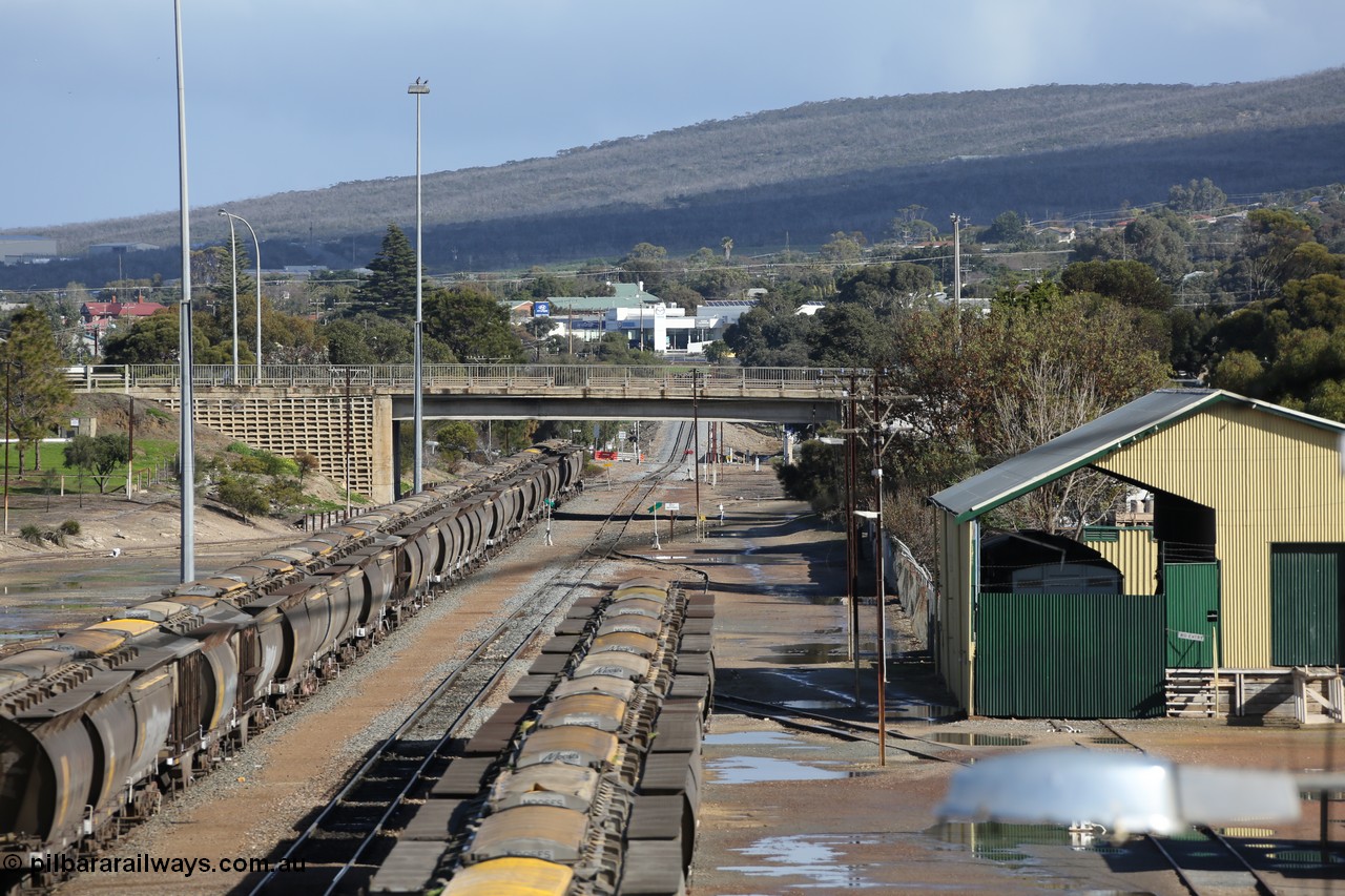 130706 0673
Port Lincoln, looking in the down direction from the London Street overbridge at the yard environs with the AN Freight Shed now museum on the right. The sign next to the point indicator states the Depot is Unattended. 6th of July 2013.
