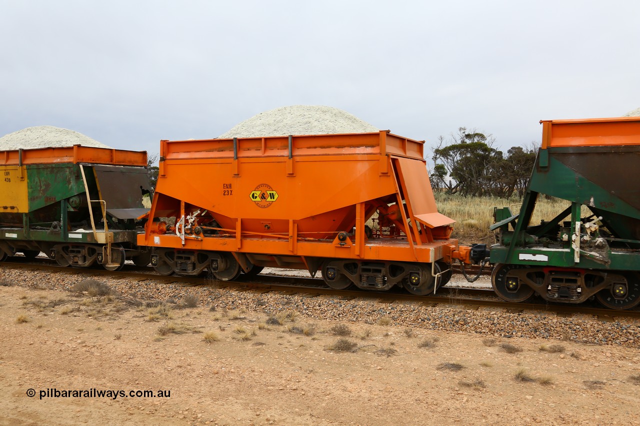 161109 1917
Moule, originally built by Kinki Sharyo as the NH type for the NAR in 1968, sent to Port Lincoln in 1978, then rebuilt and recoded ENH type in 1984, ENH 23, refurbished and wearing current owner Genesee & Wyoming orange with small decal with matching hungry boards loaded with gypsum.
Keywords: ENH-type;ENH23;Kinki-Sharyo-Japan;NH-type;NH923;
