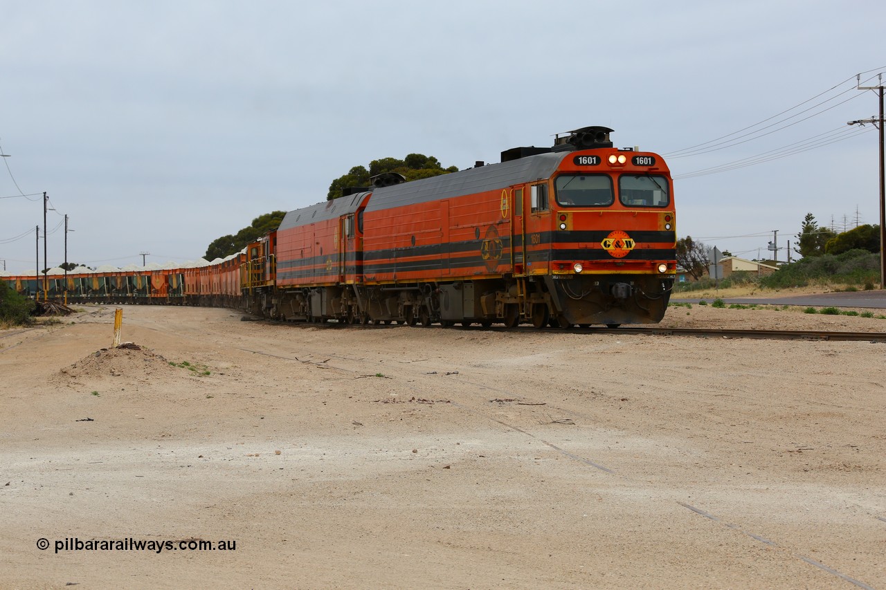 161109 1968
Thevenard, train 4DD4 enters the yard behind Genesee & Wyoming locomotives Clyde Engineering EMD model JL22C unit 1601 serial 71-728 and 1603 serial 71-730 as they negotiate the yard to the GRA siding balloon for unloading.
Keywords: 1600-class;1601;Clyde-Engineering-Granville-NSW;EMD;JL22C;71-728;NJ-class;NJ1;