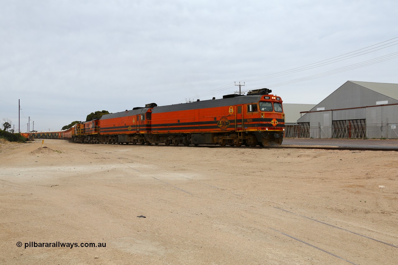 161109 1970
Thevenard, train 4DD4 enters the yard behind Genesee & Wyoming locomotives Clyde Engineering EMD model JL22C unit 1601 serial 71-728 and 1603 serial 71-730 as they negotiate the yard to the GRA siding balloon for unloading.
Keywords: 1600-class;1601;Clyde-Engineering-Granville-NSW;EMD;JL22C;71-728;NJ-class;NJ1;