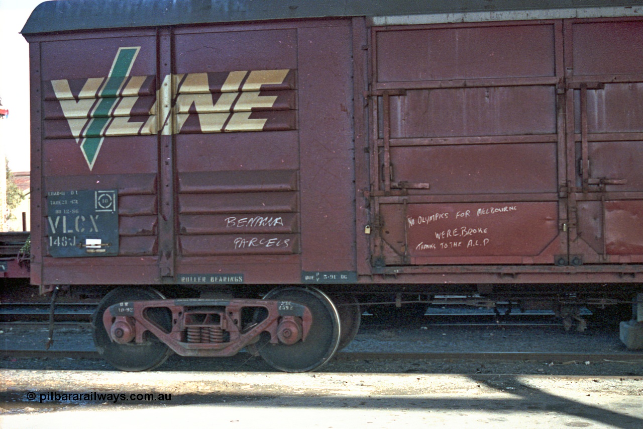 103-26
Benalla, broad gauge V/Line VLCX type bogie louvre van VLCX 148 built by Victorian Railways Bendigo Workshops as a VLX type louvre van in June 1965, recoded in 1979 to VLCX, Freightgate shed, close up of bogie, number board.
Keywords: VLCX-type;VLCX148;Victorian-Railways-Bendigo-WS;VLX-type;