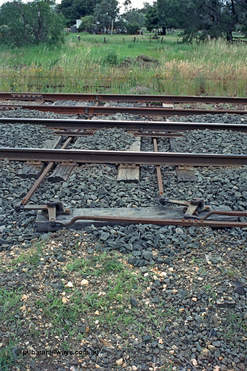 104-09
Buangor crossing loop, detail shot of point rodding changing direction and passing under the tracks.
