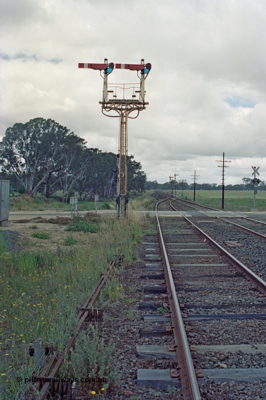 104-14
Buangor crossing loop, yard view looking east, mechanical somersault semaphore signal post 3, Up Home, facing camera for Melbourne bound trains, mechanical somersault semaphore signal post 2, Down Home, in the distance for Ararat bound traffic.
