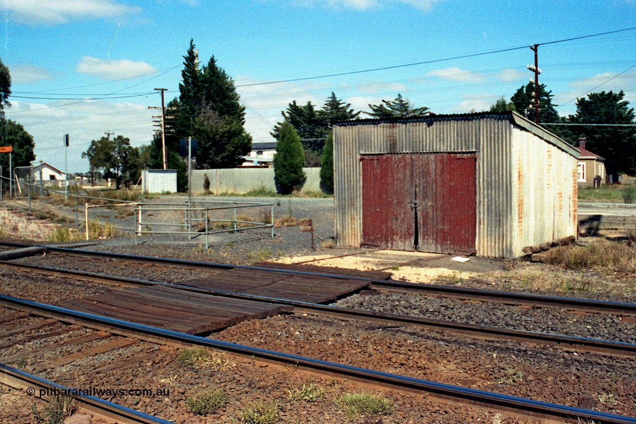 105-13
Wallan, gangers trolley shed, front 3/4 view, shows track timber work, crib crossing.
