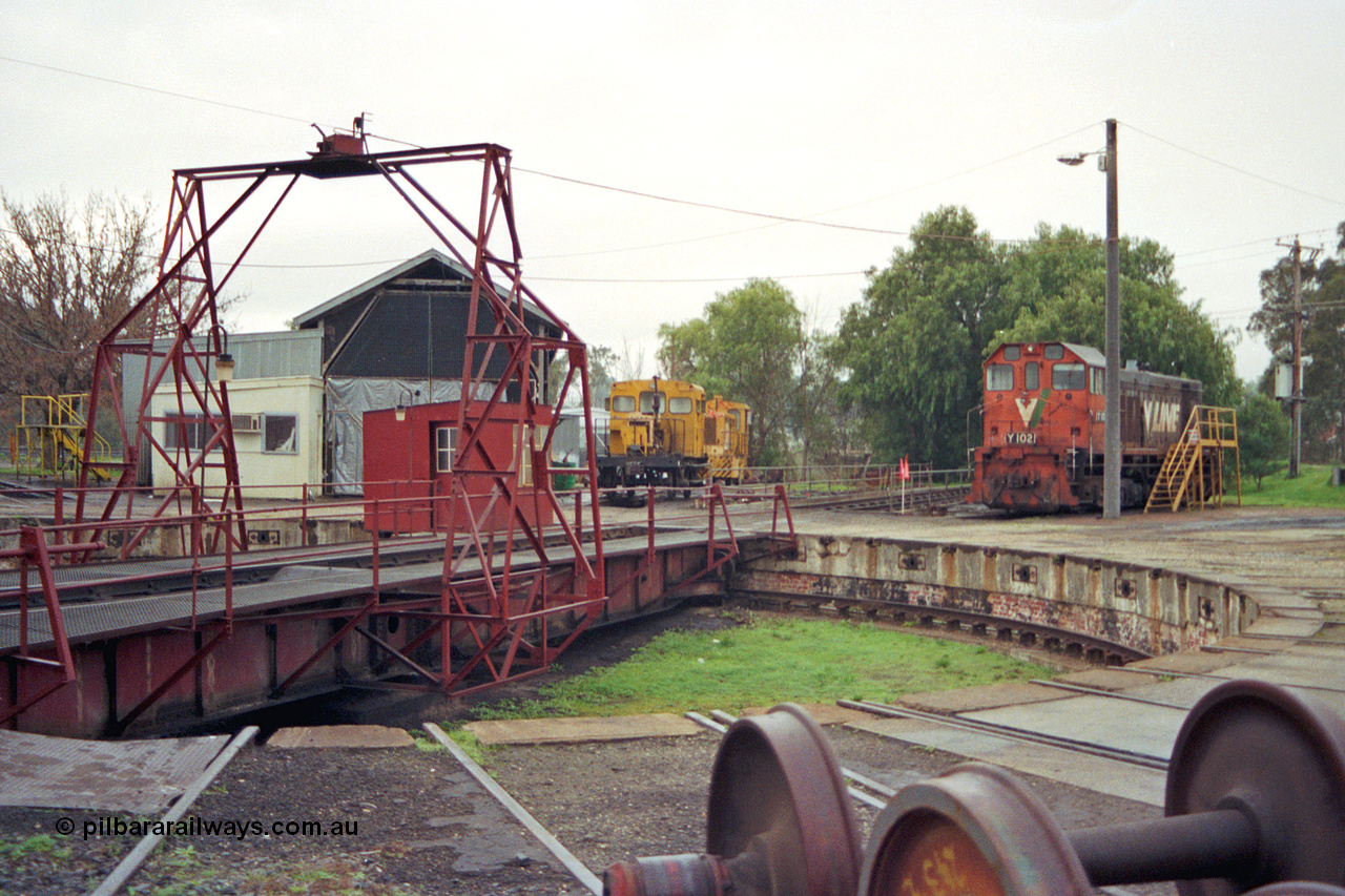 106-27
Seymour loco depot turntable and pit, V/Line standard gauge Y class Y 102 Clyde Engineering EMD model G6B serial 63-292, turntable, gantry and pit, loco shed, rail tractor RT class and Aresco Trak Chief RT 46, wheel sets at right.
Keywords: Y-class;Y102;Clyde-Engineering-Granville-NSW;EMD;G6B;63-292;RT-class;RT46;Aresco;Trak-Chief;rail-tractor;