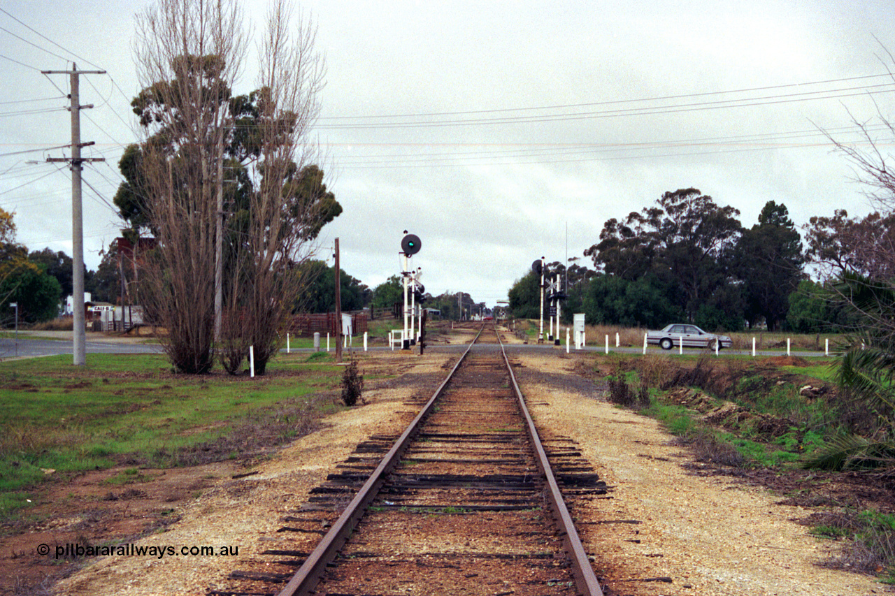 107-00
Kyabram station yard overview, looking south from the Echuca end, searchlight signal post, up home arrival.
