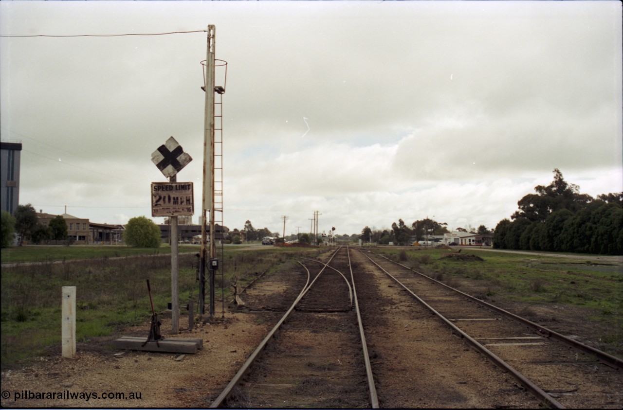 107-12
Tongala station yard, Nestle factory siding with staff locked points looking north, 20 MPH speed board.
